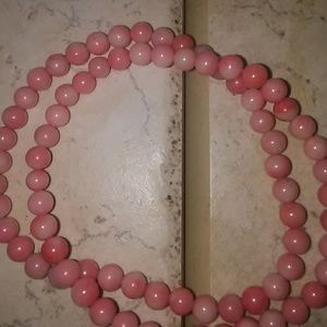Two coral stretch bracelets